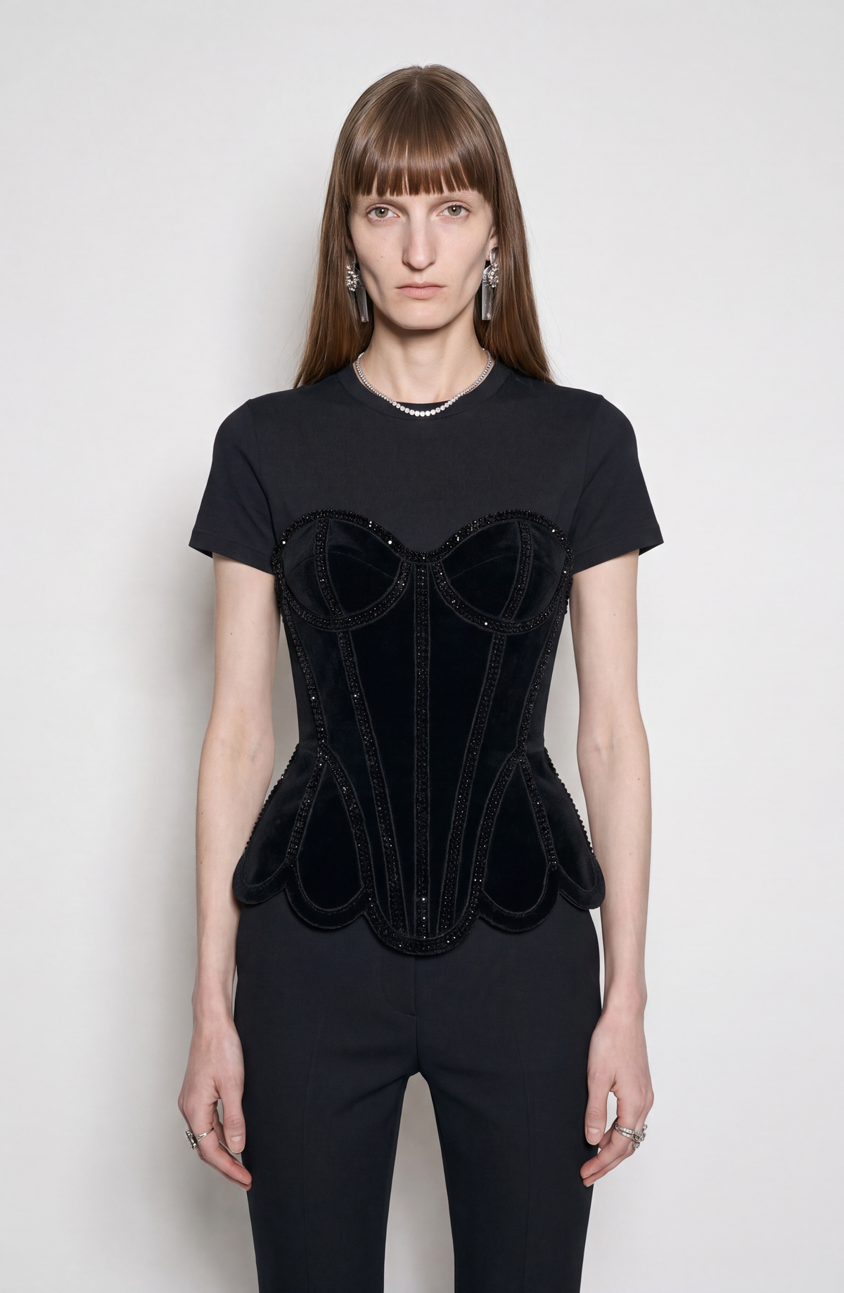 Black short-sleeve T-shirt with structured corset-style front and sparkling trim