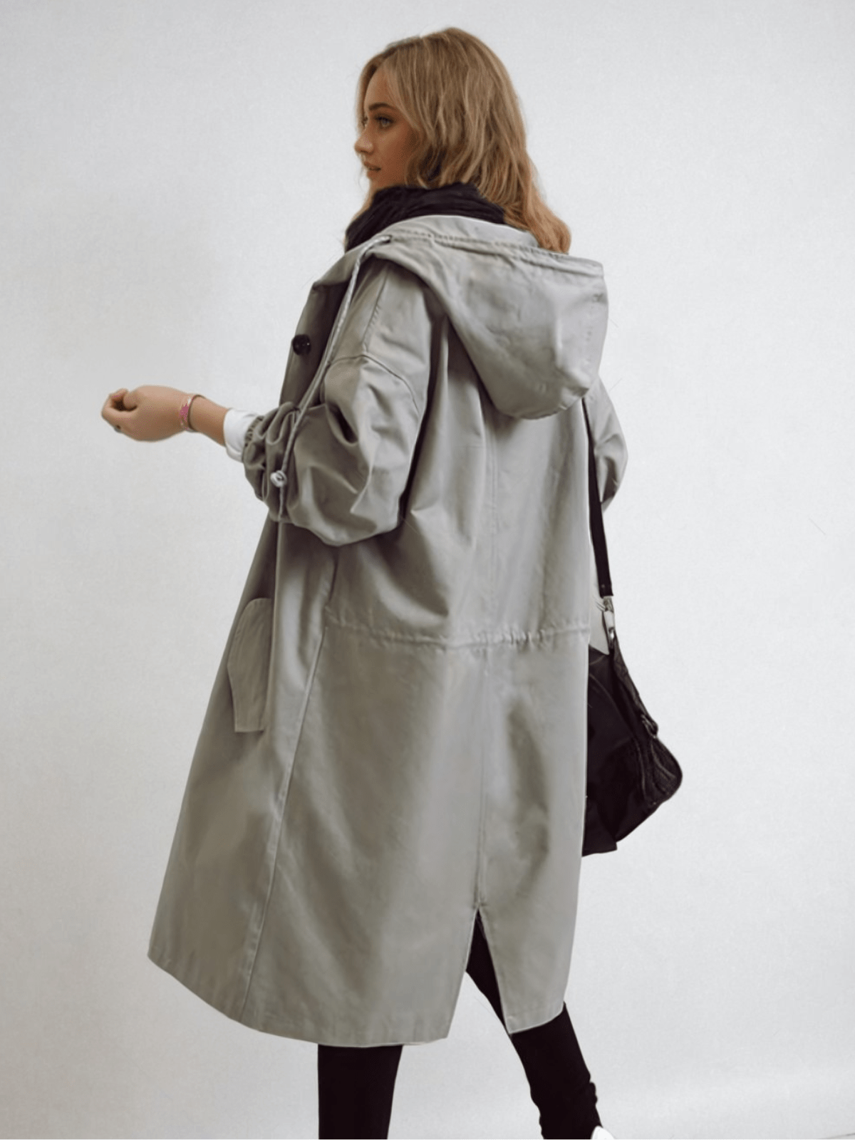 Women's longline hooded trench coat with button front and elasticated cuffs