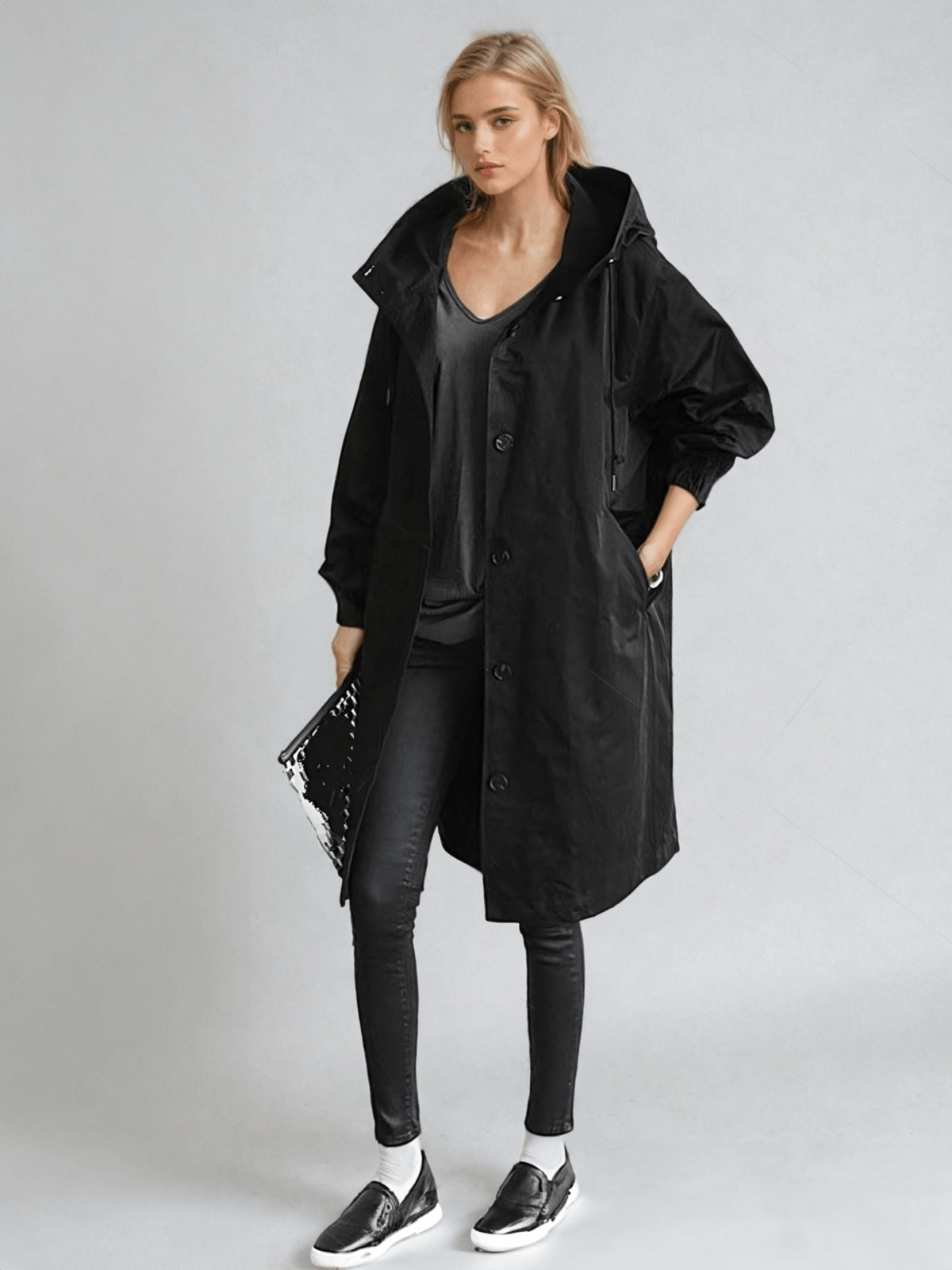 Women's longline hooded trench coat with button front and elasticated cuffs