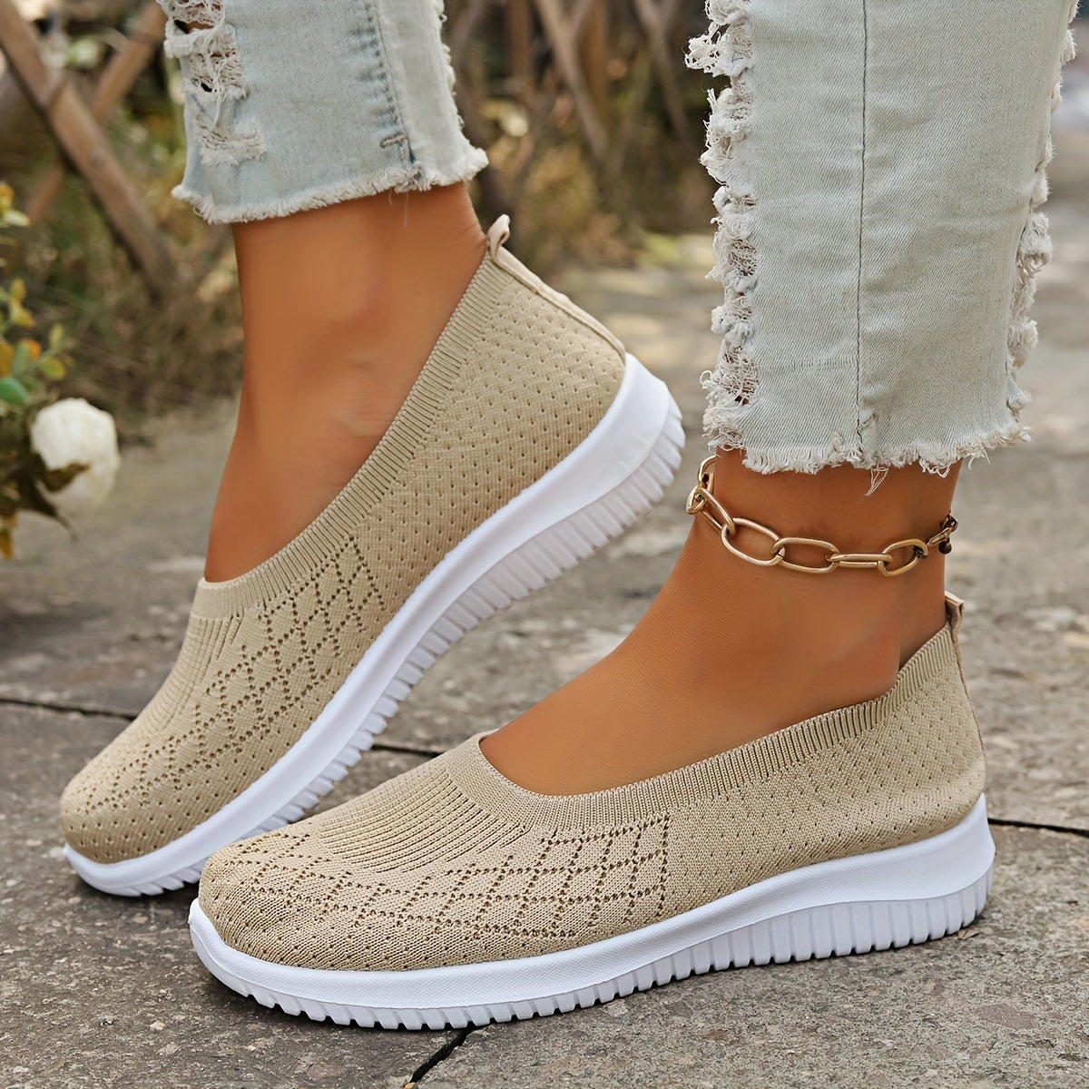 Women's geometric knit slip-on shoes with closed round toes and white ridged soles