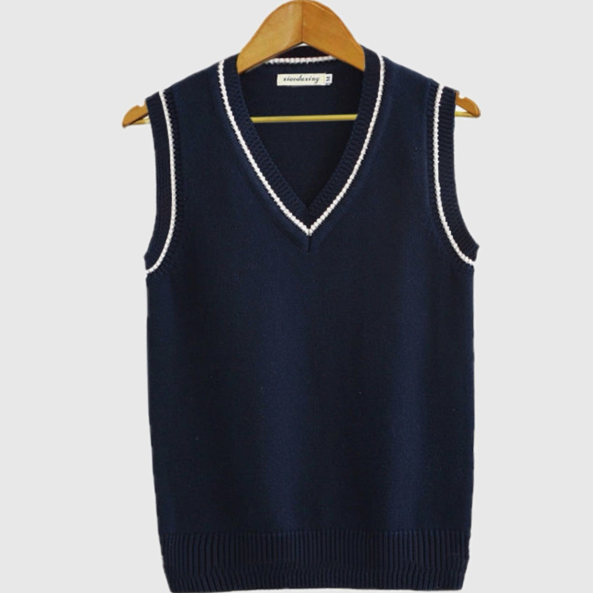 Women's sleeveless cable-knit sweater vest with striped V-neck and hem