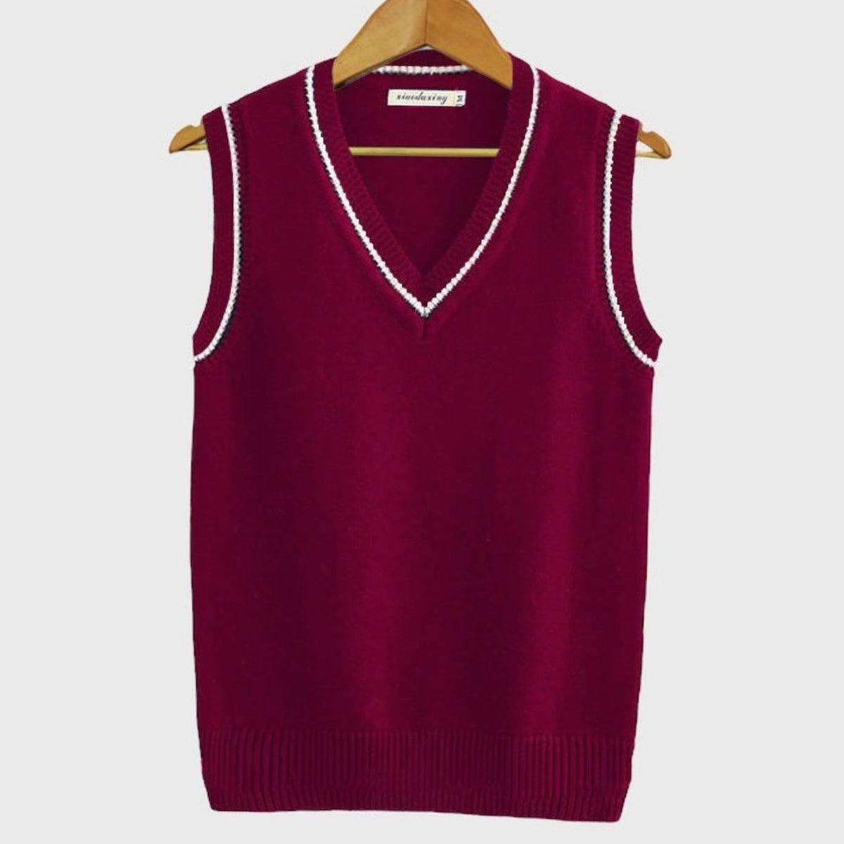 Women's sleeveless cable-knit sweater vest with striped V-neck and hem