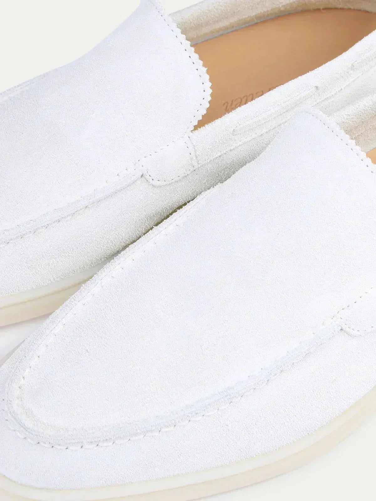Men's white classic slip-on loafers with rounded toes and flat soles