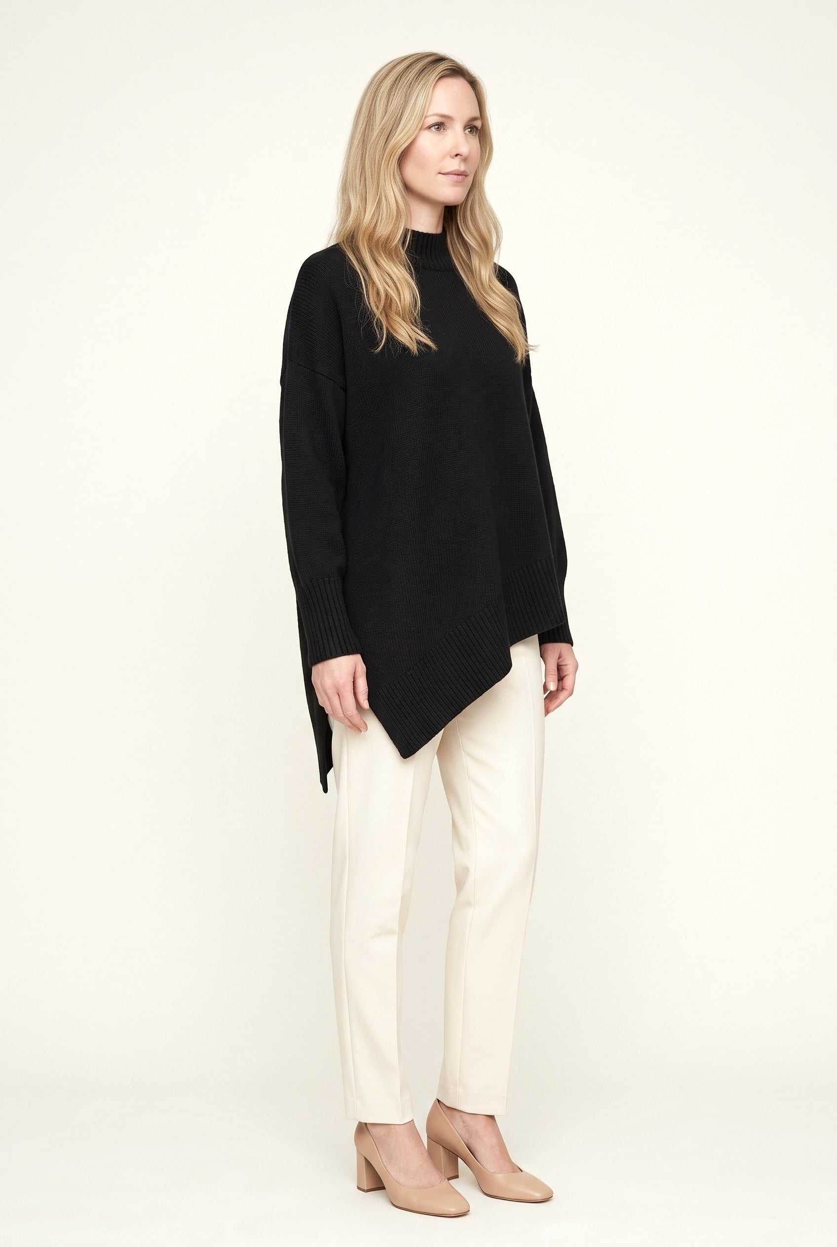 Women's oversized turtleneck sweater with long sleeves and asymmetric hem