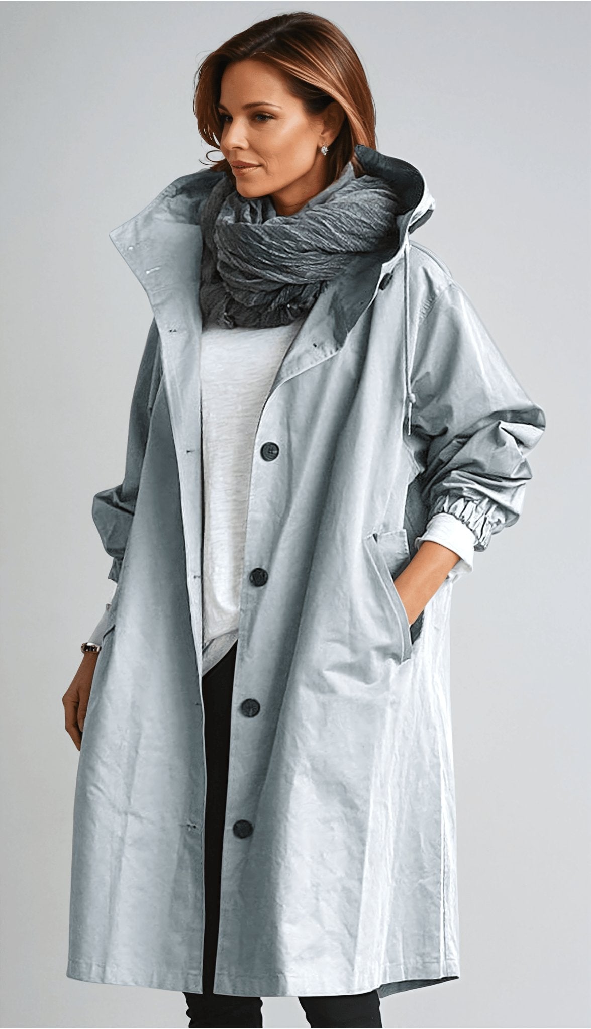 Women's oversized hooded rain parka coat with button front and long sleeves