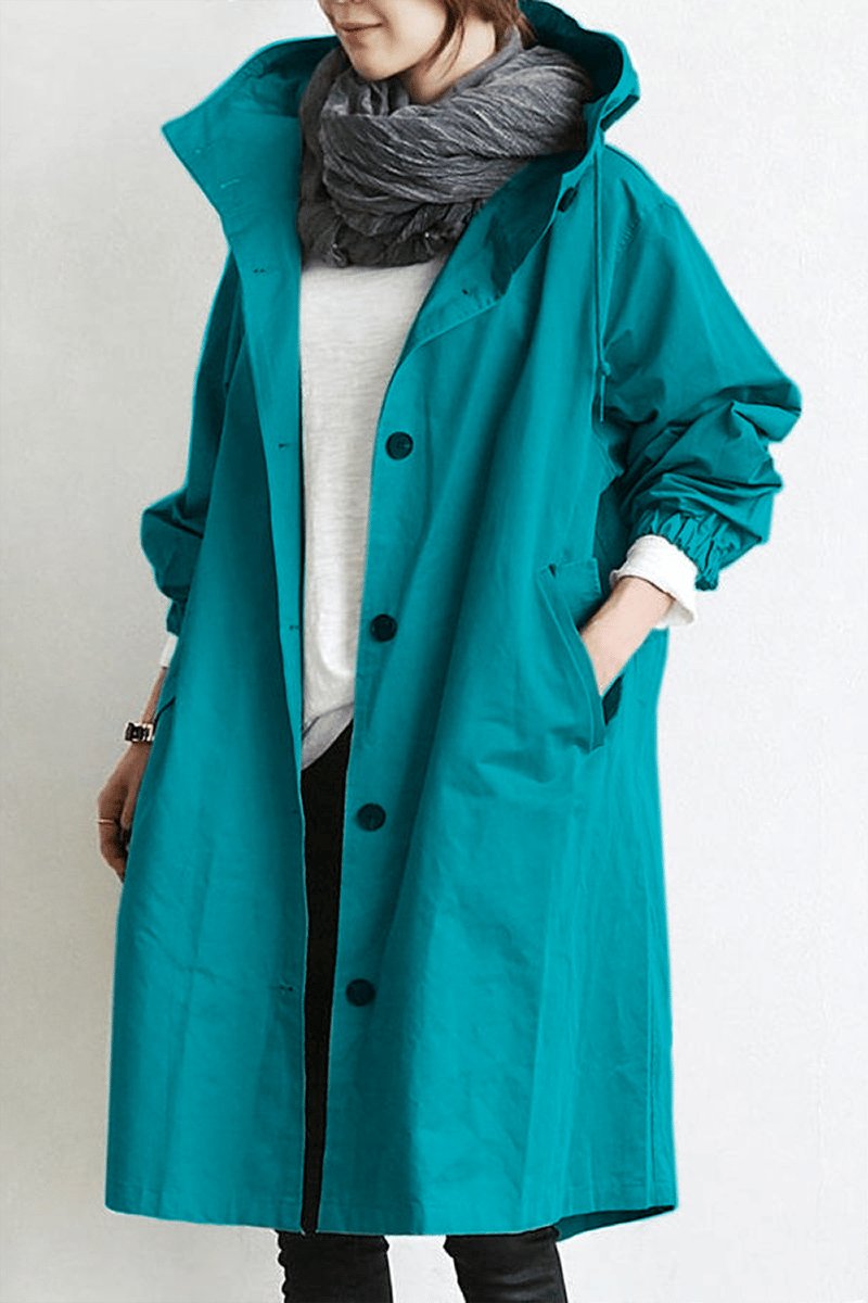 Women's oversized hooded rain parka coat with button front and long sleeves
