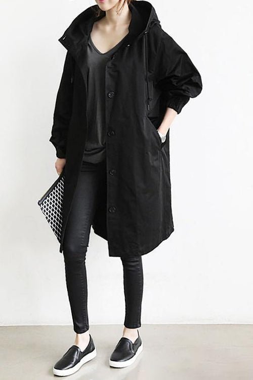 Women's oversized hooded rain parka coat with button front and long sleeves
