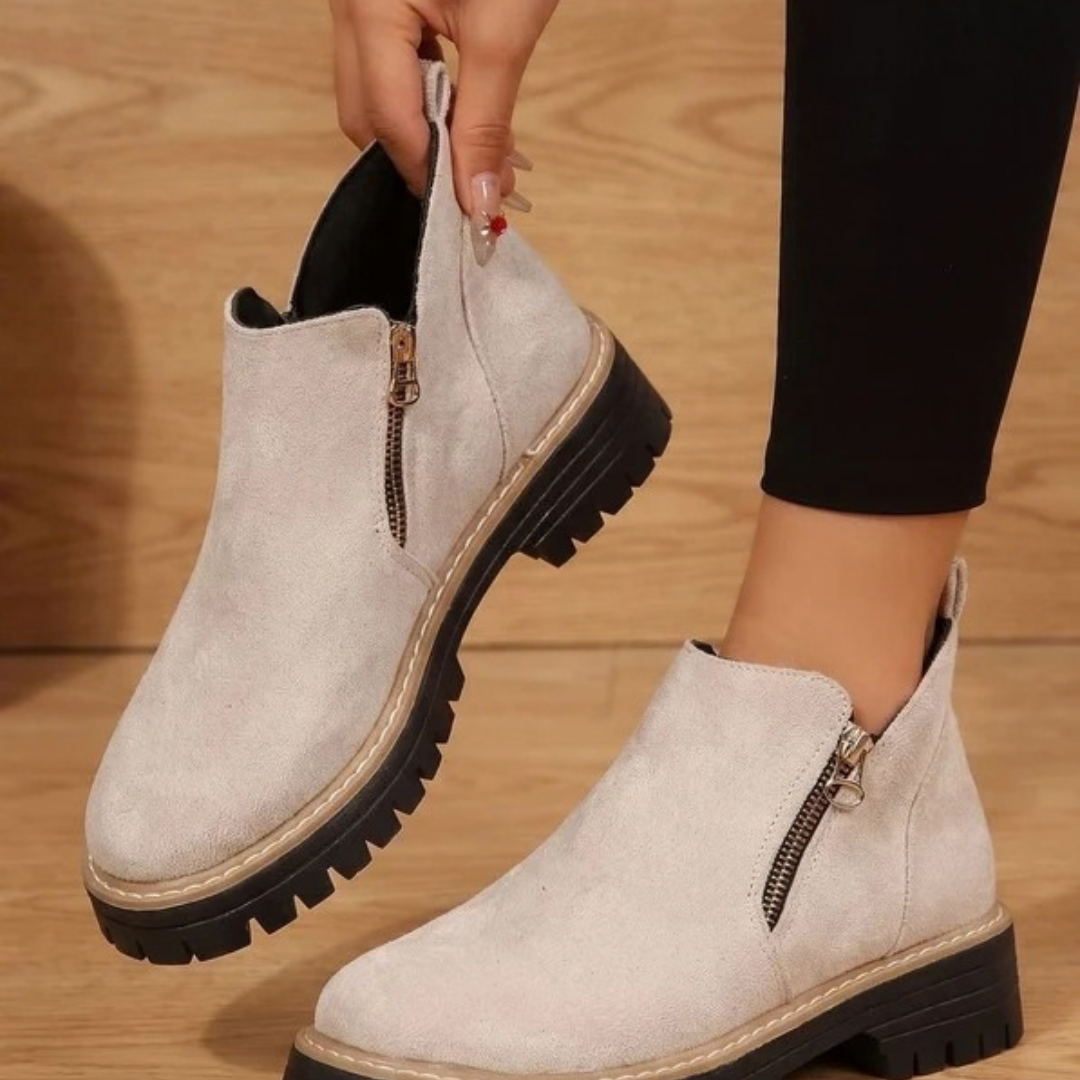 Women's ankle boots with side zips, low heels and lugged soles