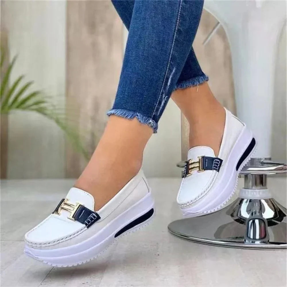 Women's platform moc toe loafers with slip-on design and metal bar trim