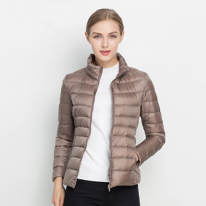 Women's quilted jacket with high collar, long sleeves and zip front