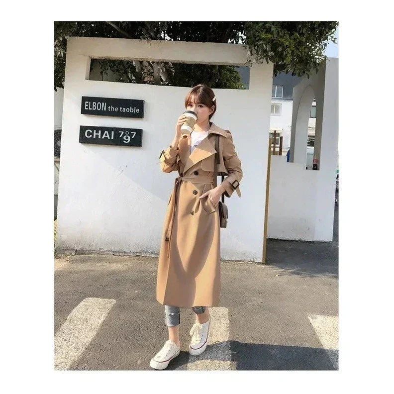 Women's long double-breasted trench coat with belt and notched lapels
