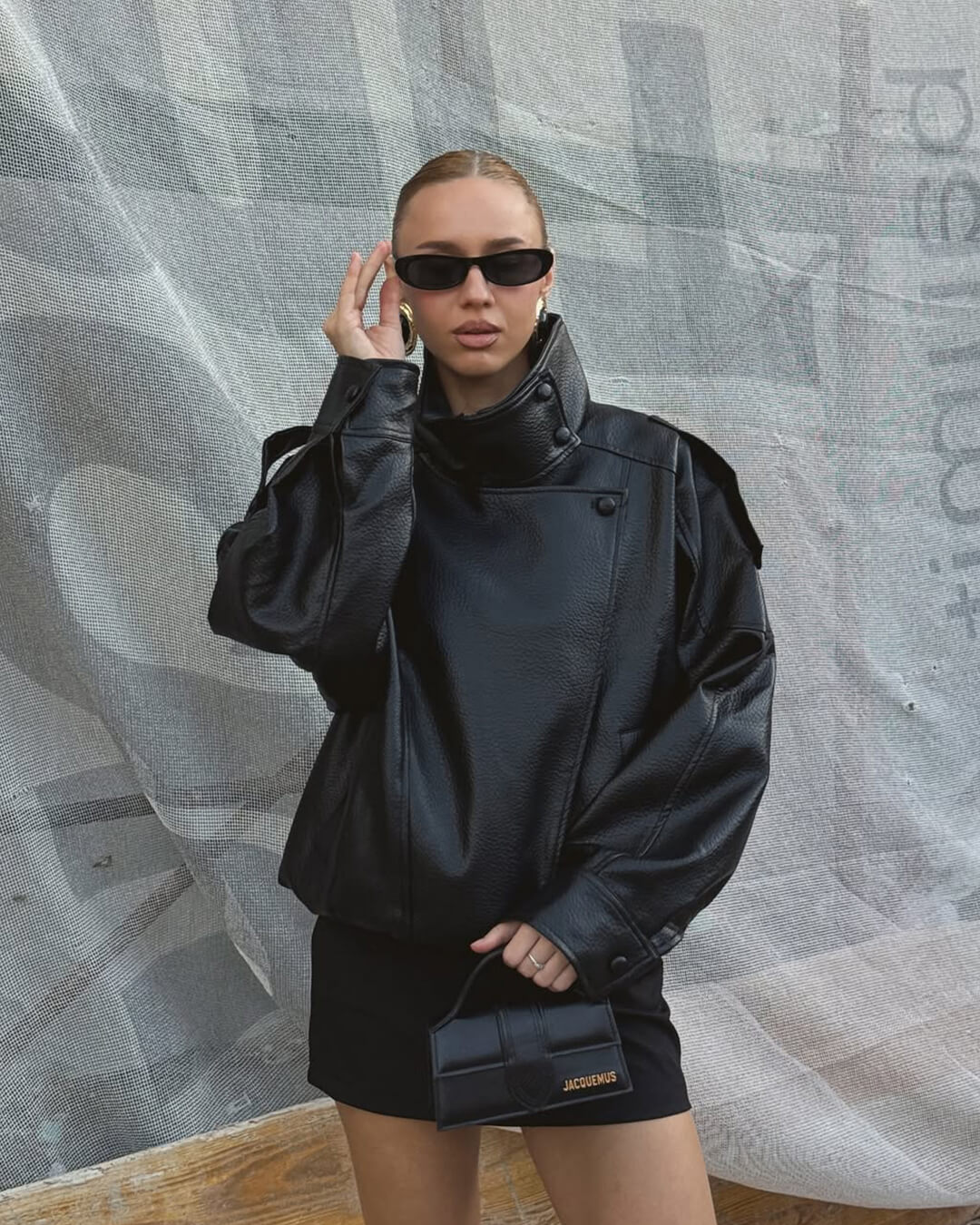 Women's asymmetric black biker jacket with high collar and diagonal zip