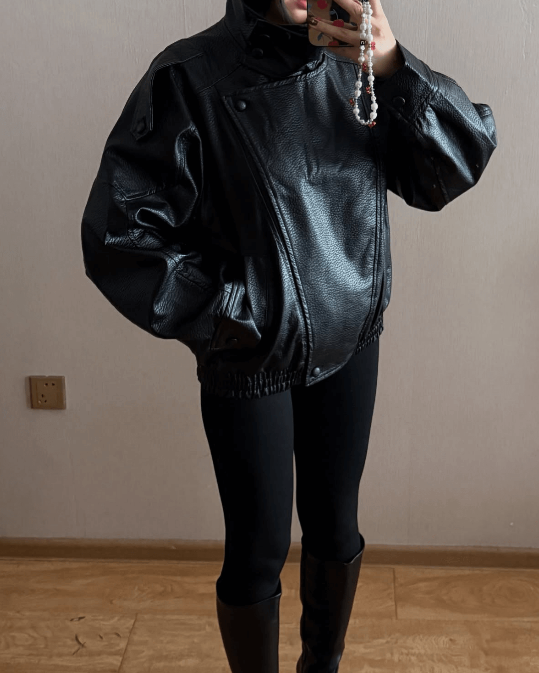 Women's asymmetric black biker jacket with high collar and diagonal zip