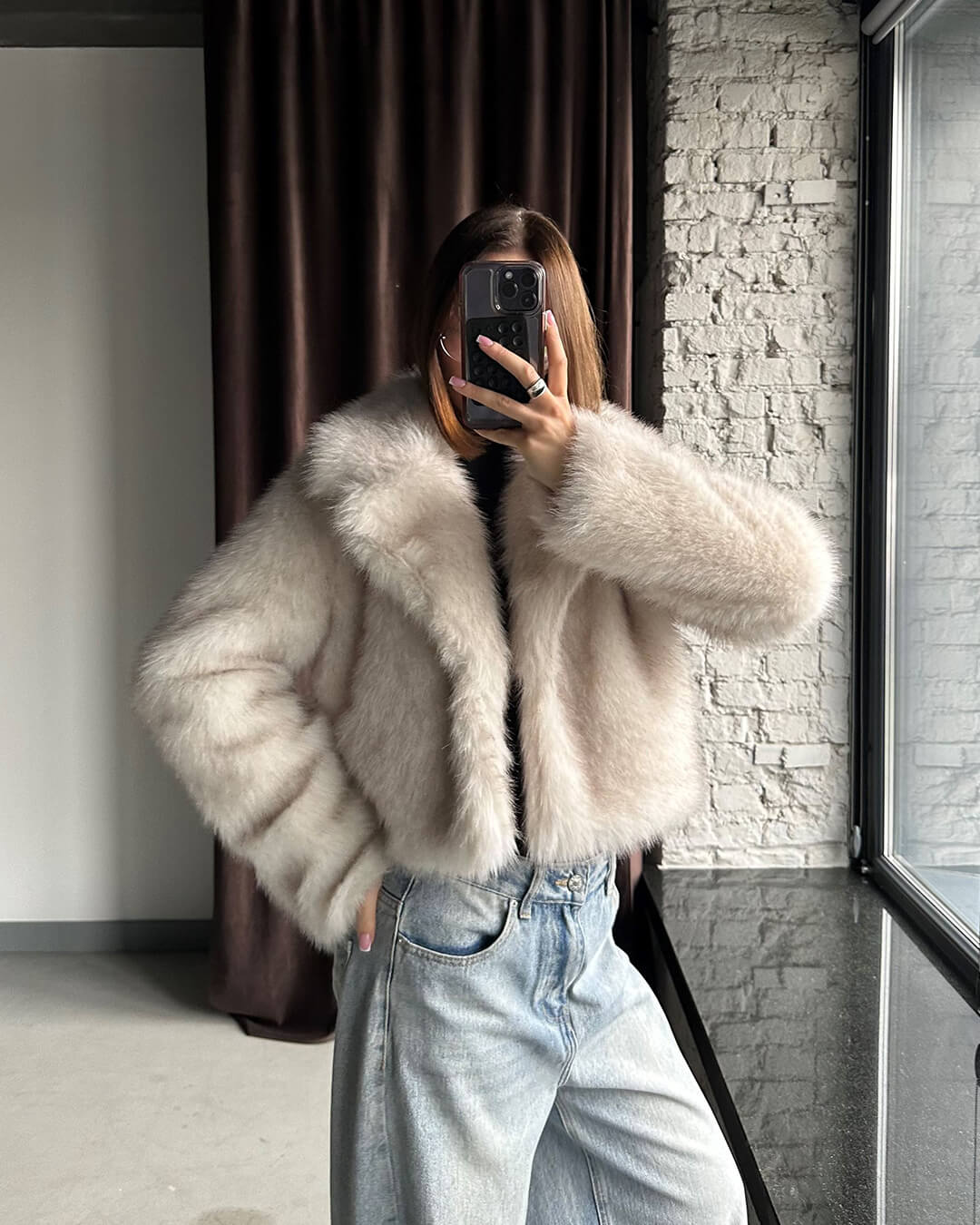 Women's cream cropped jacket with a textured finish and long sleeves