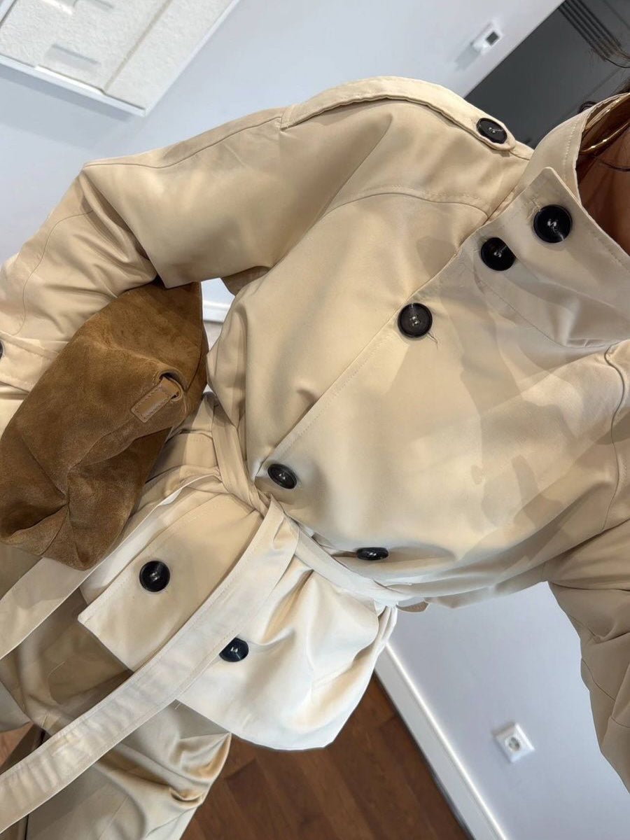 Women's cropped trench coat with stand collar, buttons and tie belt