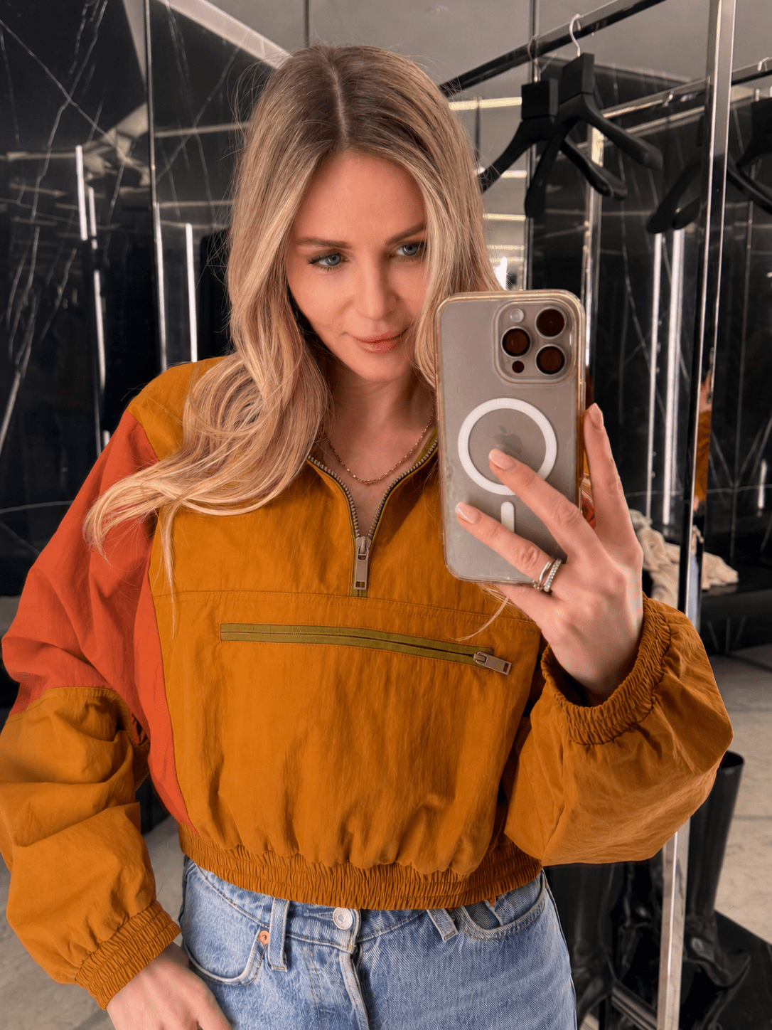 Women's cropped half-zip windbreaker jacket with stand collar and zipped chest pocket