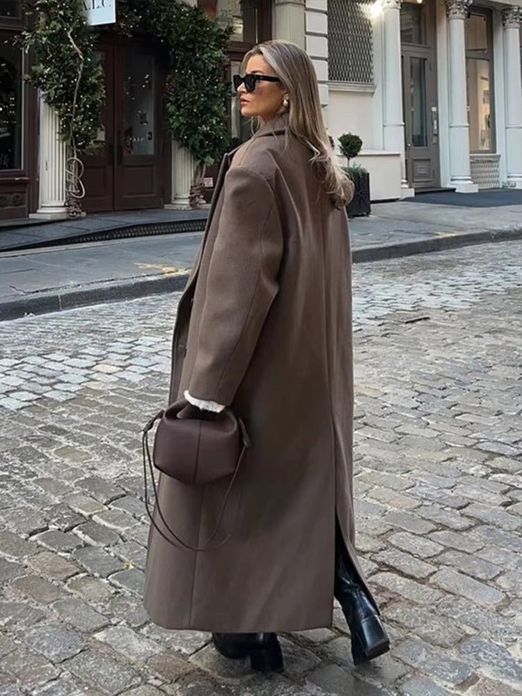 Women's long brown double-breasted coat with notched lapels and long sleeves