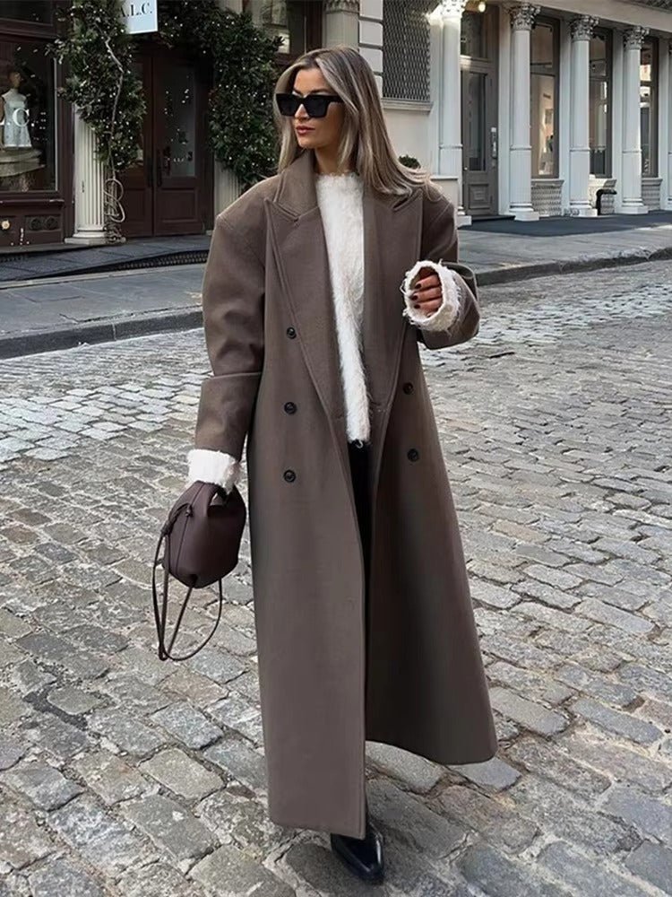 Women's long brown double-breasted coat with notched lapels and long sleeves