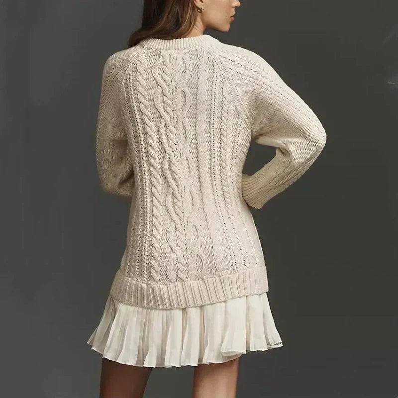 Women's cable knit mini dress with crew neck, long sleeves and pleated skirt panel