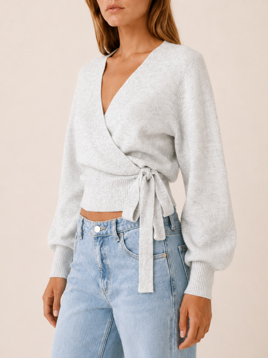 Women's wrap knit jumper with V-neckline, long sleeves and waist tie