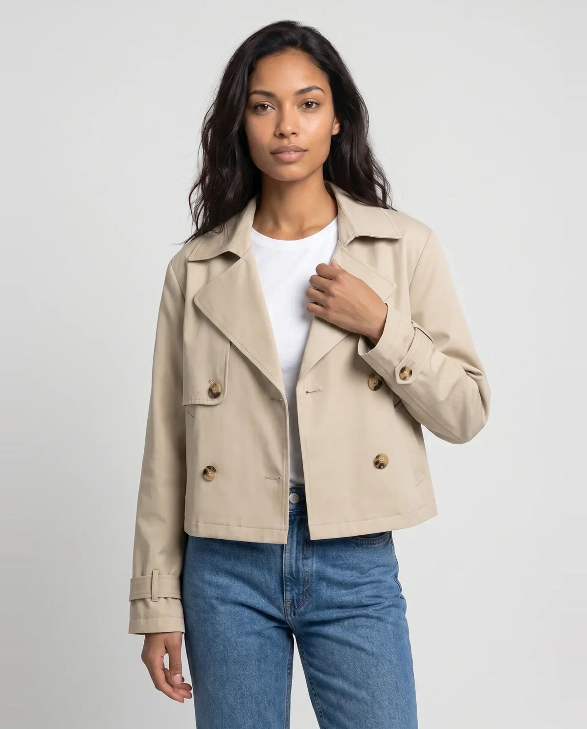 Women's beige cropped double-breasted trench jacket with long sleeves and cuff straps