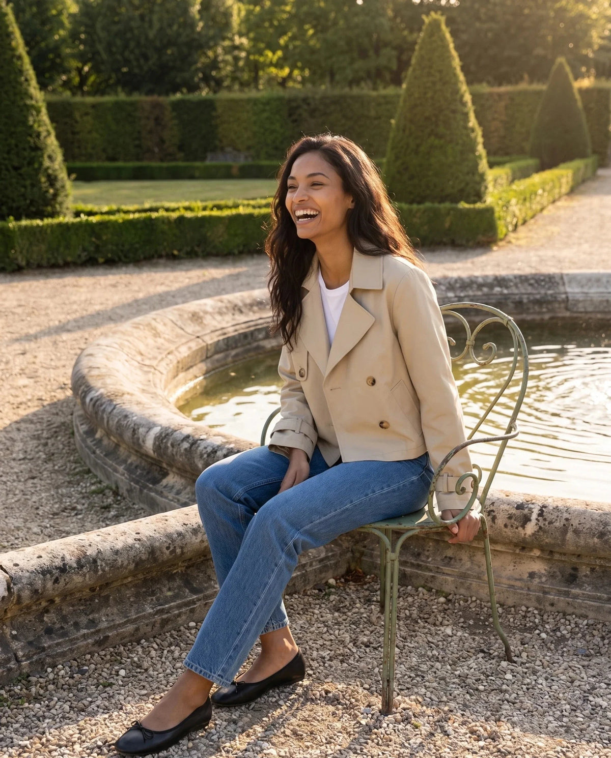 Women's beige cropped double-breasted trench jacket with long sleeves and cuff straps