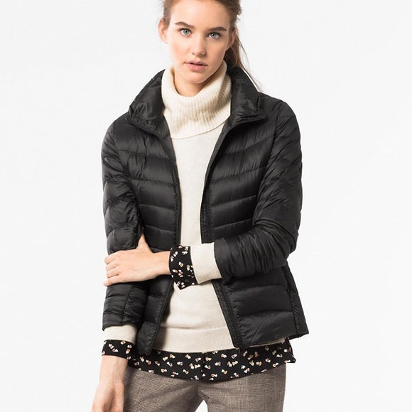 Women's quilted jacket with high collar, long sleeves and zip front