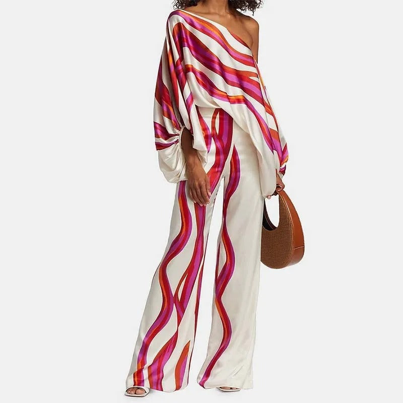 Women's off-shoulder batwing top and wide-leg trousers co-ord set with bold striped patterns
