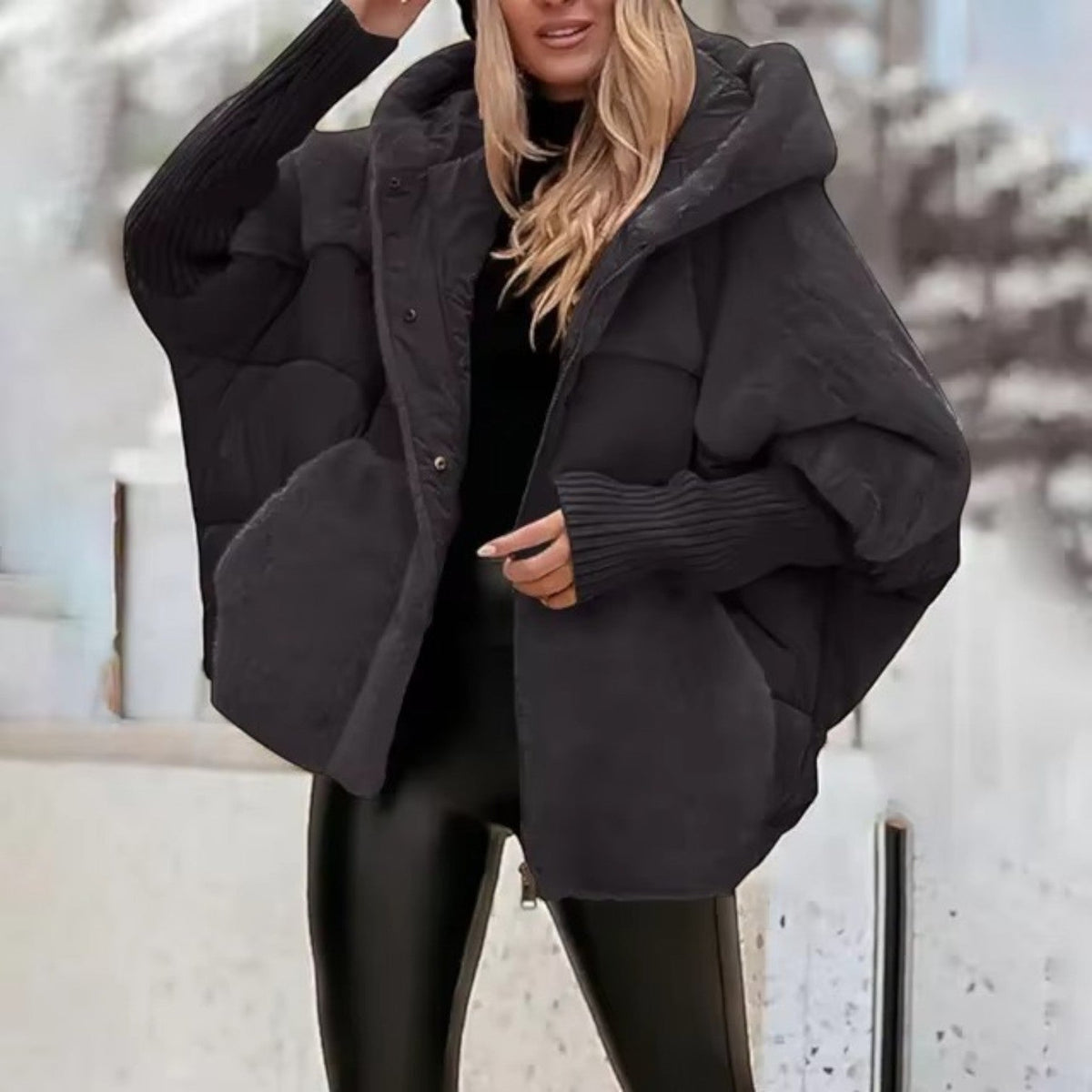 Women's oversized padded hooded jacket with ribbed cuffs and zip front