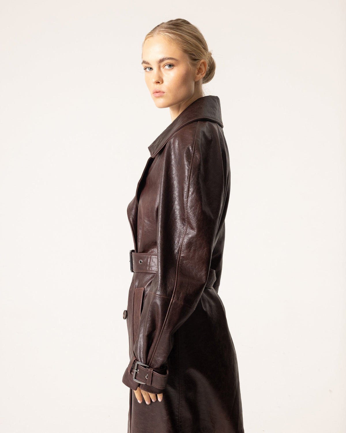Women's brown belted trench coat with wide collar and long sleeves