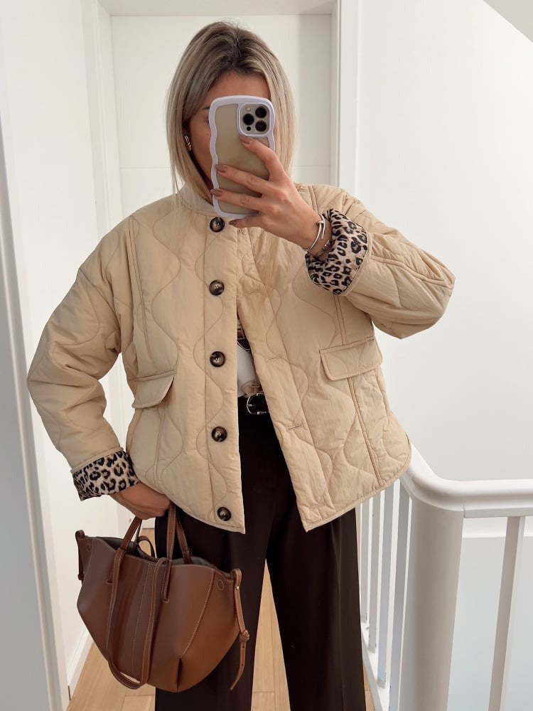 Women's quilted jacket with leopard print cuffs, button front and flap pockets