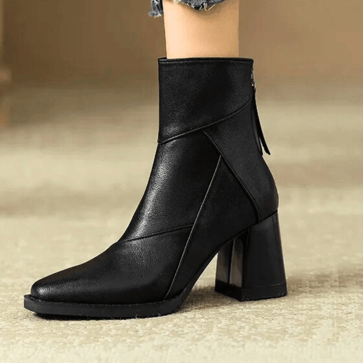 Women's pointed toe ankle boots with high flared block heels and stitched panel details