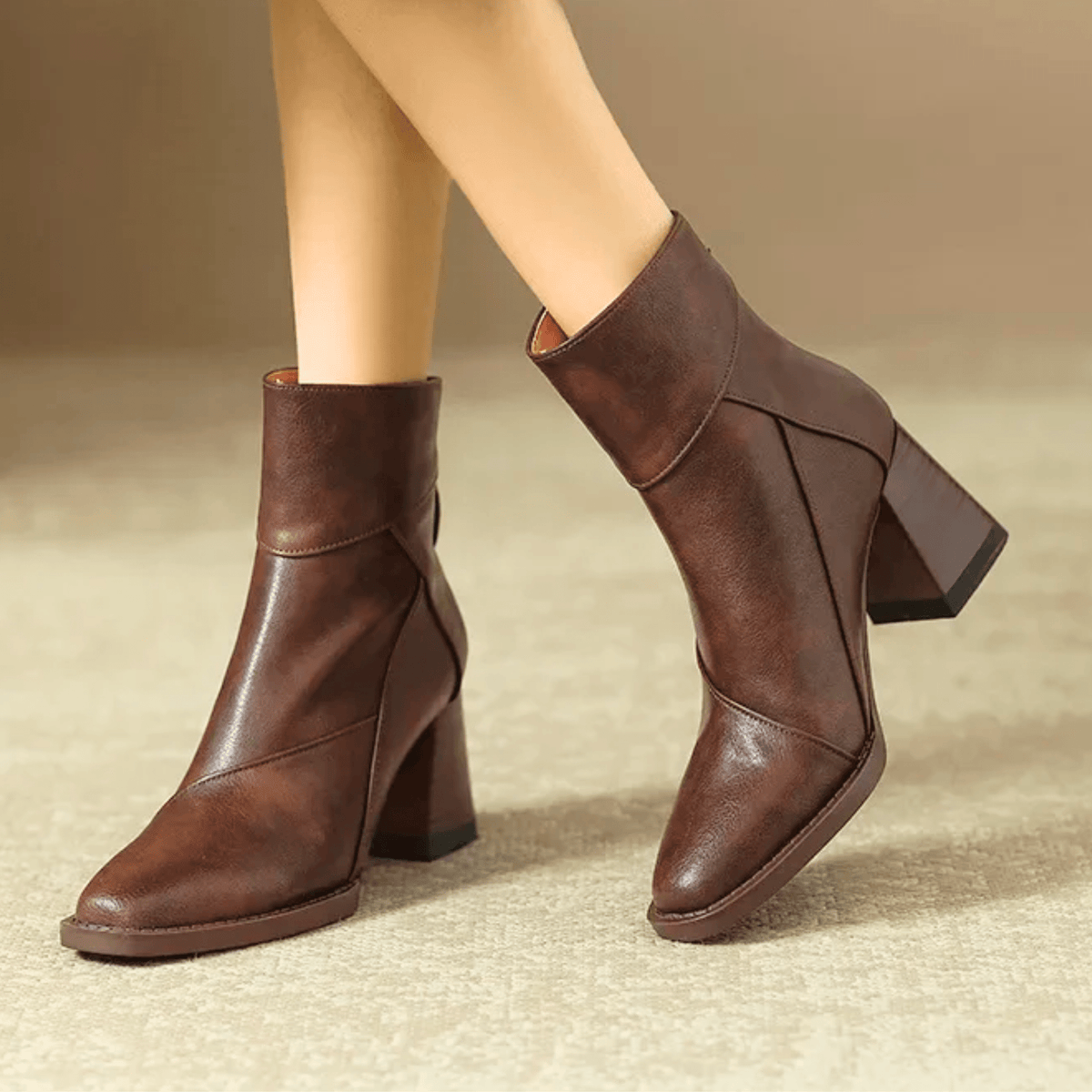 Women's pointed toe ankle boots with high flared block heels and stitched panel details