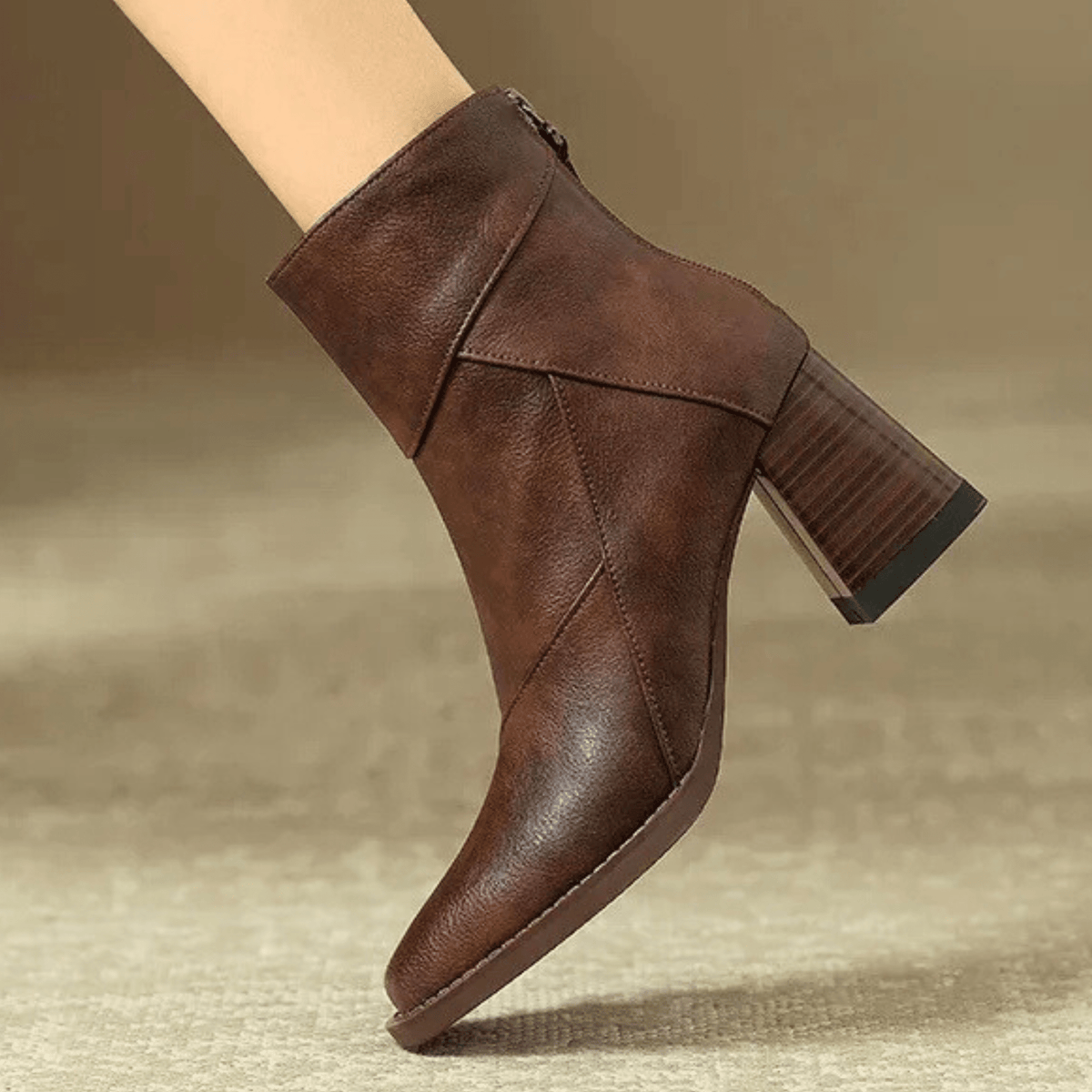 Women's pointed toe ankle boots with high flared block heels and stitched panel details