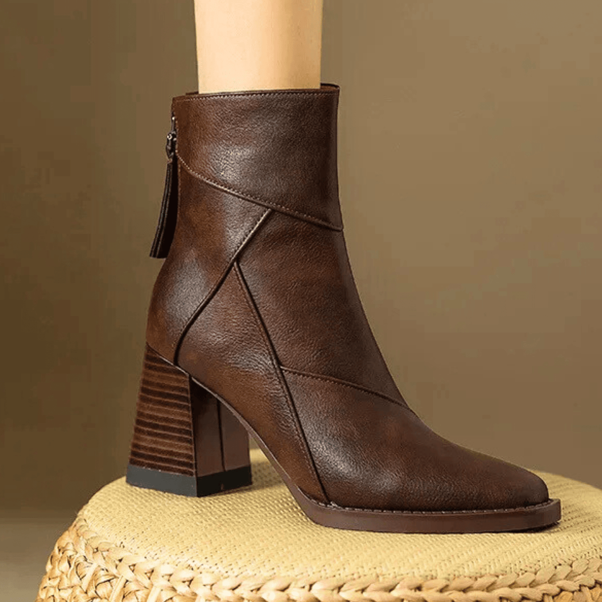 Women's pointed toe ankle boots with high flared block heels and stitched panel details