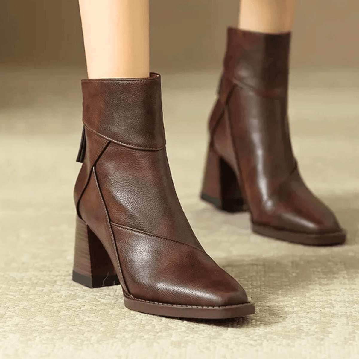 Women's pointed toe ankle boots with high flared block heels and stitched panel details