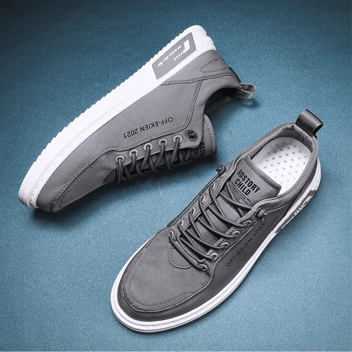 Men's low-top lace-up sneakers with stitched panels, round toes and contrasting white soles