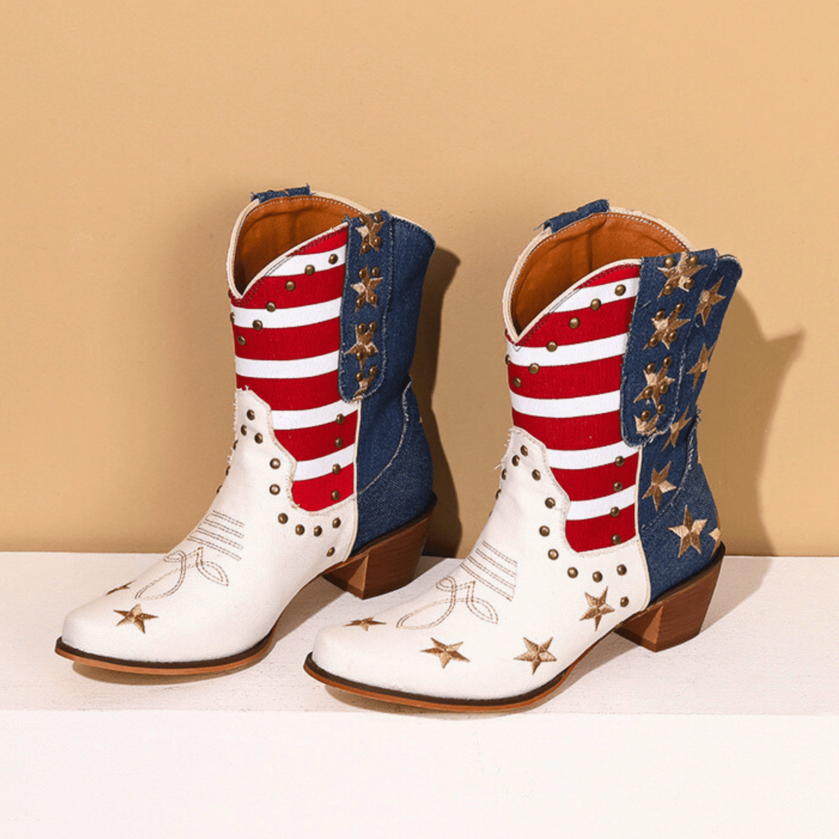 Women's ivory-white cowboy boots with red stripes, blue star panels and pointed toes
