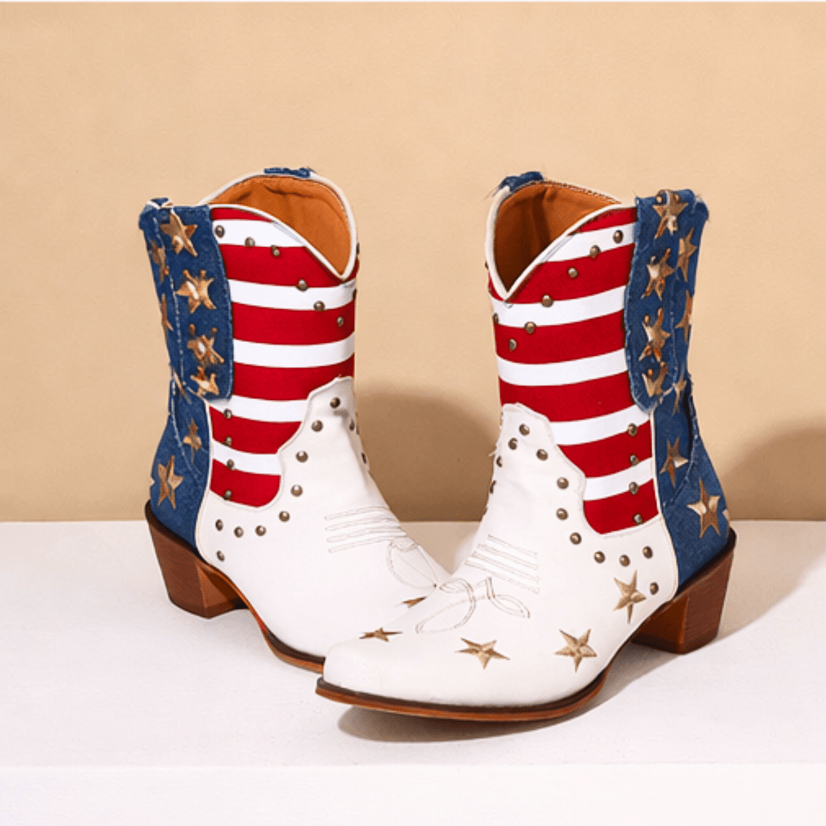 Women's ivory-white cowboy boots with red stripes, blue star panels and pointed toes