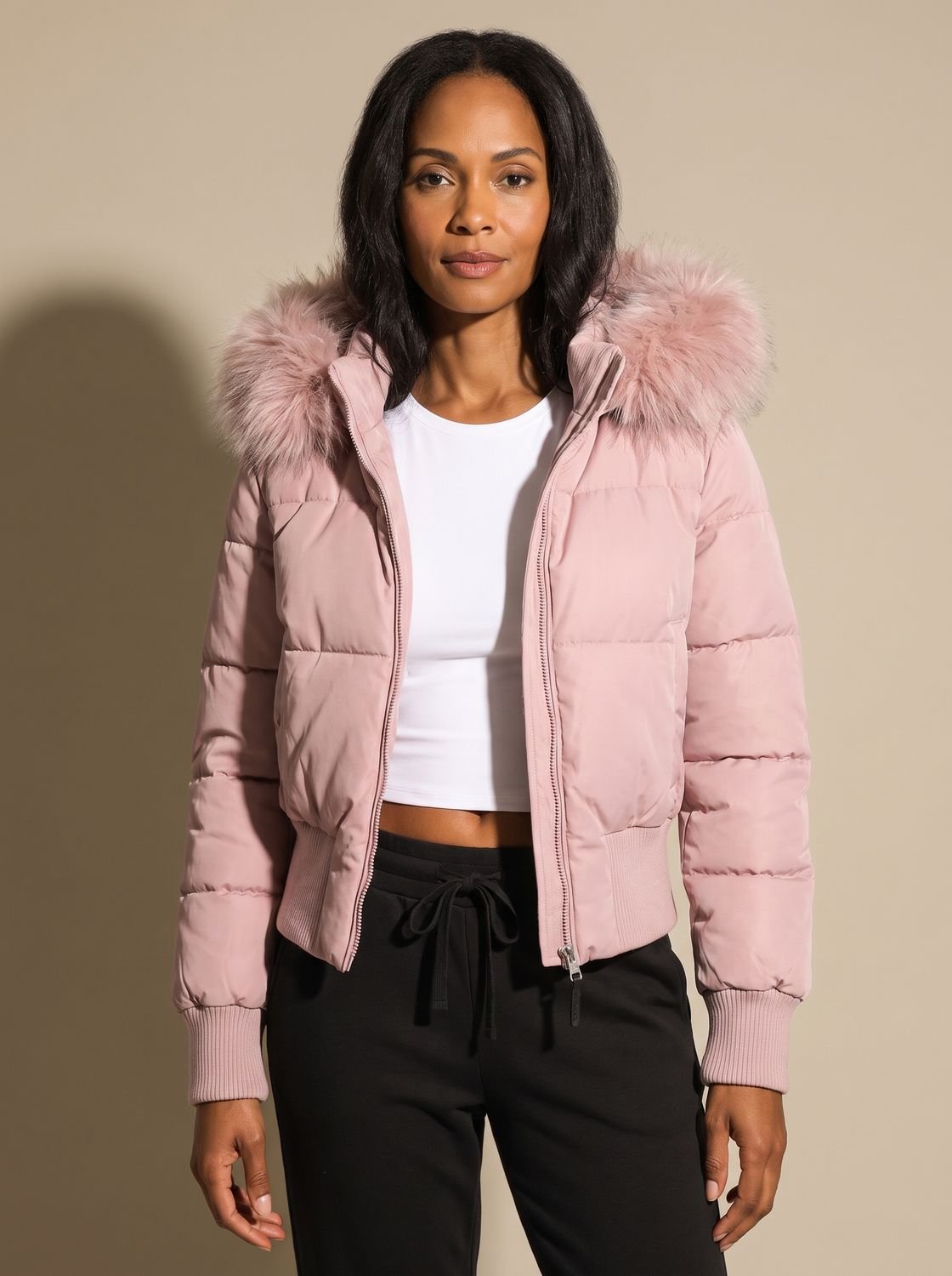 Women's hooded quilted puffer jacket with long sleeves and textured hood trim
