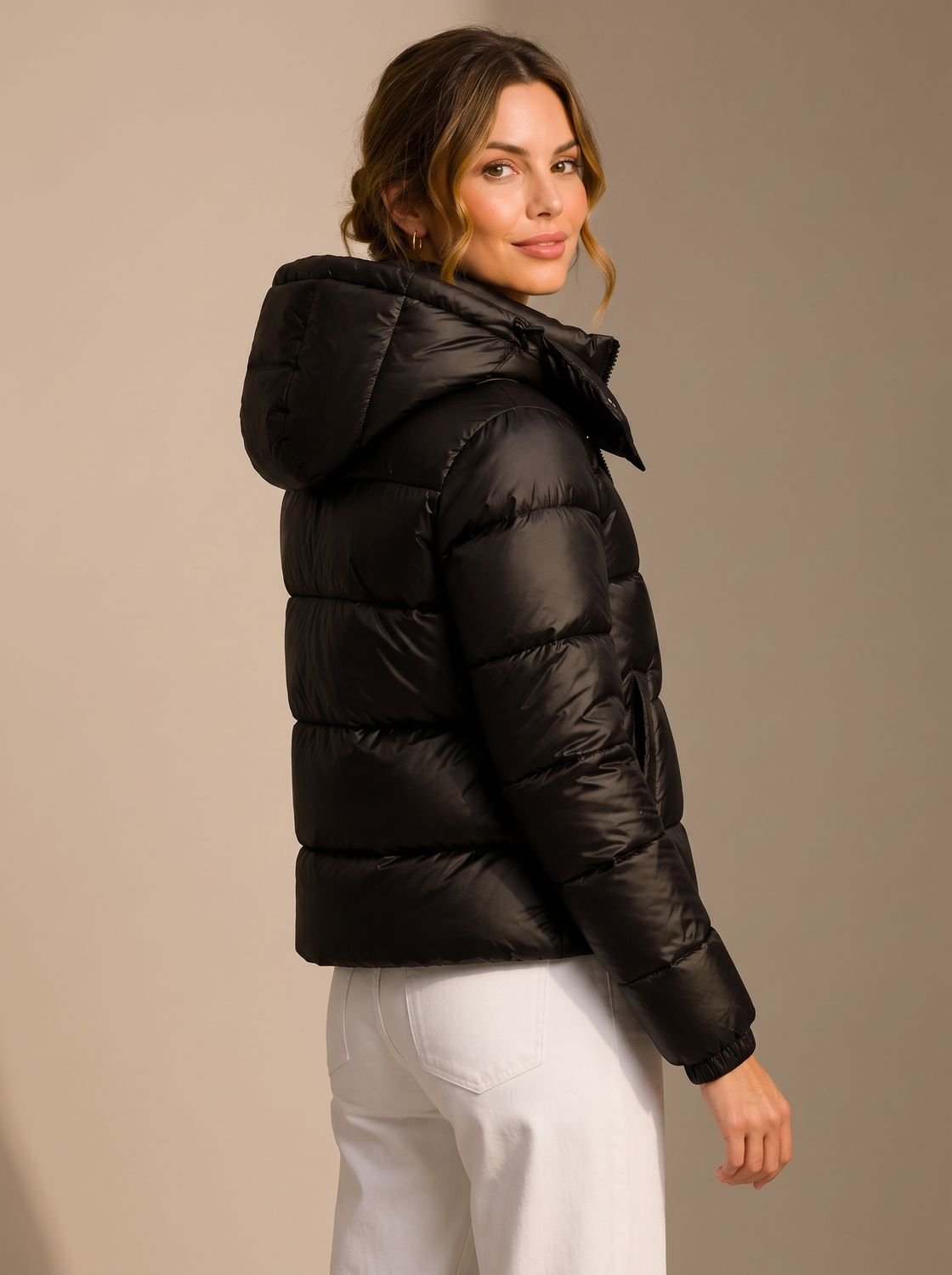 Women's hooded quilted puffer jacket with long sleeves and zip front