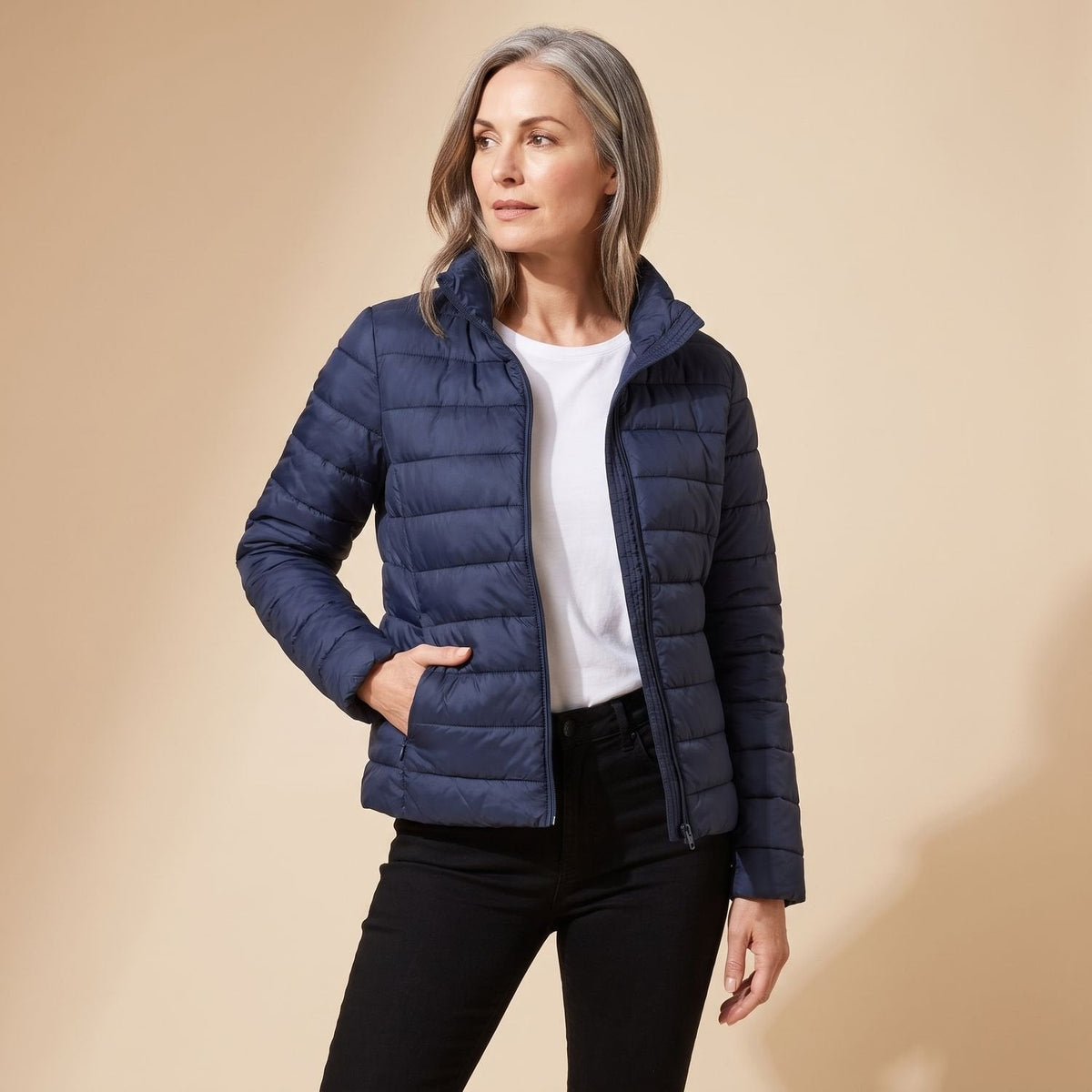 Women's hooded quilted puffer jacket with long sleeves and zip front