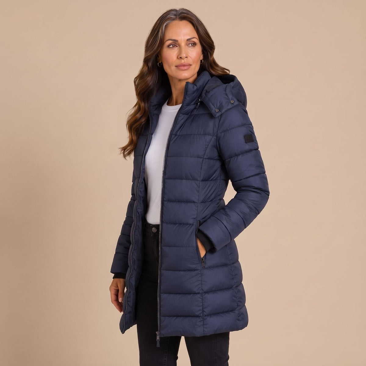 Women's hooded quilted puffer jacket with long sleeves and zip front