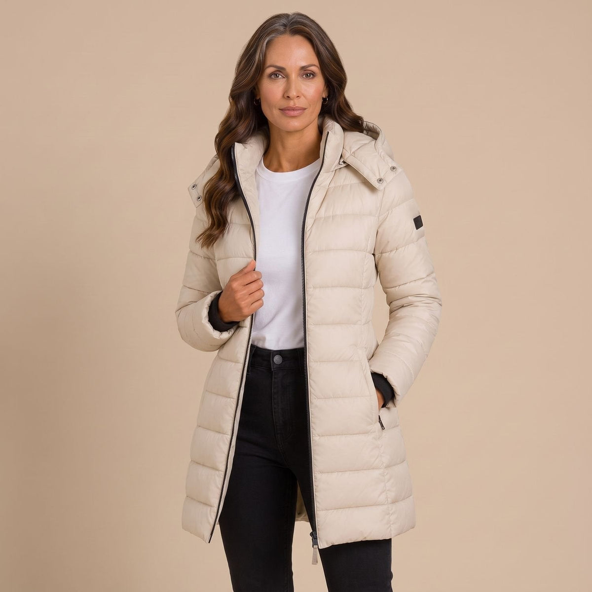 Women's hooded quilted puffer jacket with long sleeves and zip front