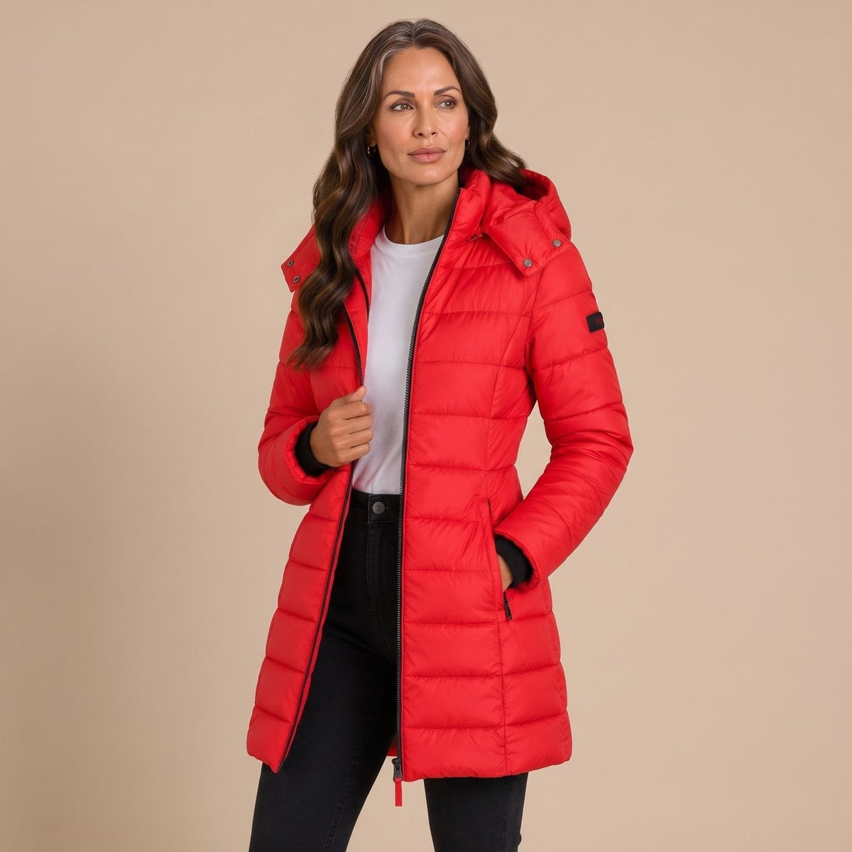 Women's hooded quilted puffer jacket with long sleeves and zip front