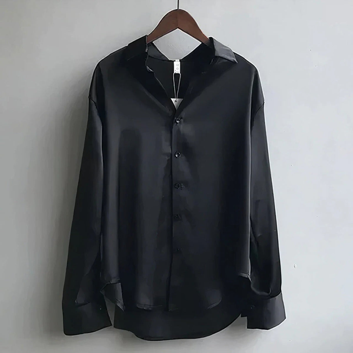 Women's plain long-sleeve button-down blouse with pointed collar and relaxed fit