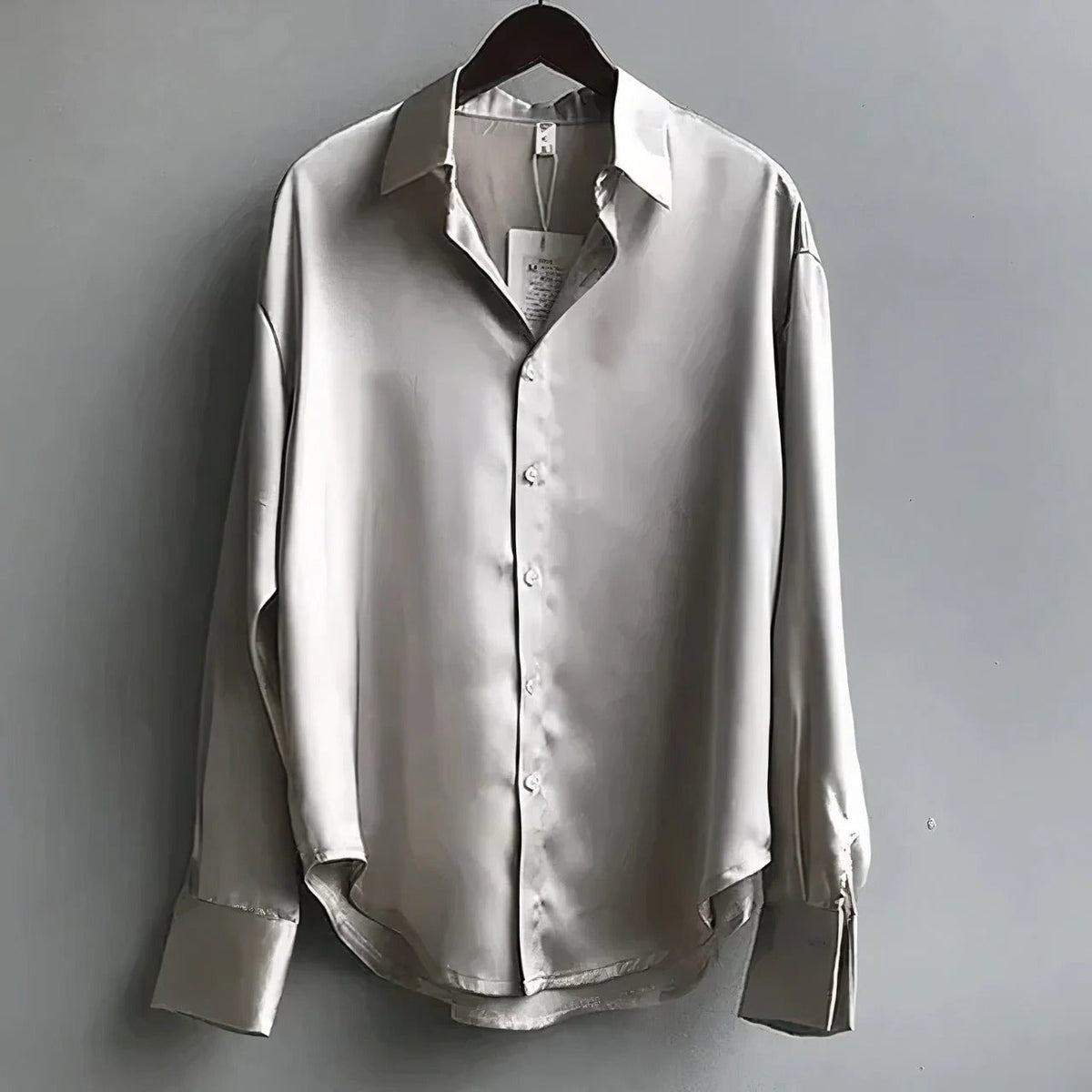 Women's plain long-sleeve button-down blouse with pointed collar and relaxed fit