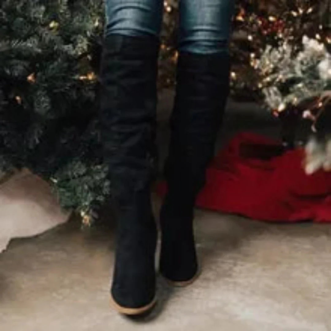 Women's slouch knee-high boots with pointed toes, flat heels and buckle details